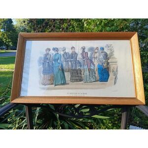 Framed antique French fashion publication, featuring various victorian women